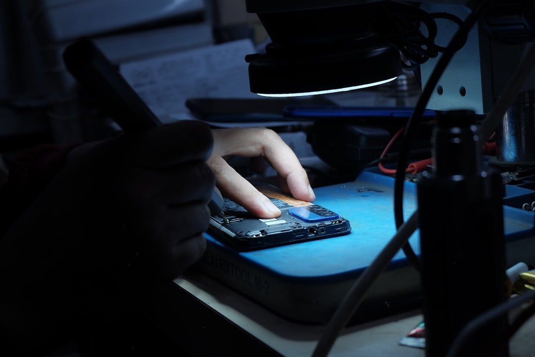 researcher holding battery cell