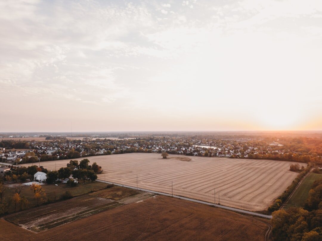 drone flying over farm field