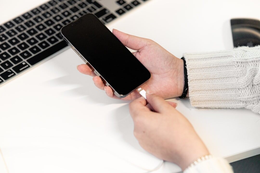 person charging smartphone